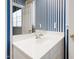Bright bathroom showcasing a vanity with white counter and gold fixtures at 205 Buncombe St, Raleigh, NC 27609