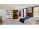 Bright bedroom with carpet, ceiling fan and ensuite bath, including a closet and lots of natural light at 205 Buncombe St, Raleigh, NC 27609
