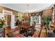 Elegant dining room with a chandelier, bay window, and hardwood floors at 205 Buncombe St, Raleigh, NC 27609
