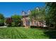 Beautiful home with a lush green lawn, showcasing its brick facade and well-maintained exterior at 205 Buncombe St, Raleigh, NC 27609