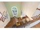 Open foyer with chandelier, hardwood steps, and a view into the dining area at 205 Buncombe St, Raleigh, NC 27609