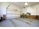 Interior of a spacious garage with white walls, a large door, and ample storage space at 205 Buncombe St, Raleigh, NC 27609