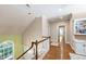 Hallway with hardwood floors, high ceilings, and access to other rooms in the home at 205 Buncombe St, Raleigh, NC 27609