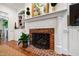 Bright and airy living room includes fireplace, built-ins and trim at 205 Buncombe St, Raleigh, NC 27609