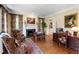 Cozy living room features a fireplace, desk space, and hardwood flooring at 205 Buncombe St, Raleigh, NC 27609
