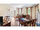 Bright living room with hardwood floors, large windows, and arched doorway at 205 Buncombe St, Raleigh, NC 27609