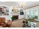 Comfortable living room boasts built-ins, a fireplace, and lots of natural light at 205 Buncombe St, Raleigh, NC 27609