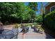 Charming backyard patio with a brick border and outdoor seating at 205 Buncombe St, Raleigh, NC 27609