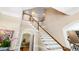 Elegant staircase with wooden banister and neutral walls, leading to the upper level at 205 Buncombe St, Raleigh, NC 27609