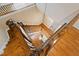 A view from the top of wood stairs with white risers and balusters overlooking the foyer at 205 Buncombe St, Raleigh, NC 27609