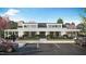 Community clubhouse featuring a modern design with a covered entrance and ample parking at 207 Yellow River Way, Garner, NC 27529