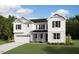 Charming two-story home with white siding, black shutters, and well-manicured lawn, ideal for suburban living at 231 Yellow River Way, Garner, NC 27529
