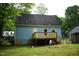 Home exterior featuring back door, deck and basement at 2315 George Anderson Dr, Hillsborough, NC 27278