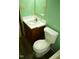 Functional bathroom with a white toilet and wood-finished vanity sink at 2315 George Anderson Dr, Hillsborough, NC 27278