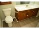 Bathroom features a toilet, vanity, sink and wood vinyl floors at 2315 George Anderson Dr, Hillsborough, NC 27278