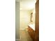 Bright bathroom with vinyl floors, vanity, toilet, and wood trim window at 2315 George Anderson Dr, Hillsborough, NC 27278