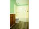 Green bathroom with a shower, toilet, and sink with wooden cabinets at 2315 George Anderson Dr, Hillsborough, NC 27278