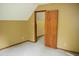 Carpeted bedroom with neutral paint, window, and closet entrance at 2315 George Anderson Dr, Hillsborough, NC 27278