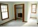 Bright bedroom with natural light, closet space, and neutral carpeting at 2315 George Anderson Dr, Hillsborough, NC 27278