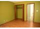 Cozy bedroom with green walls, wood floors, and closet at 2315 George Anderson Dr, Hillsborough, NC 27278