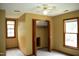 Bedroom featuring carpet, windows, closet, and a ceiling fan at 2315 George Anderson Dr, Hillsborough, NC 27278