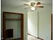 This bedroom features a ceiling fan and a closet with quirky attic access at 2315 George Anderson Dr, Hillsborough, NC 27278