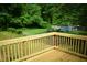New wooden deck overlooking green backyard with woods at 2315 George Anderson Dr, Hillsborough, NC 27278