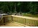 New wooden deck overlooking green backyard with woods at 2315 George Anderson Dr, Hillsborough, NC 27278