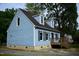 Charming blue house with white trim, dark shutters and roof, and a small porch at 2315 George Anderson Dr, Hillsborough, NC 27278