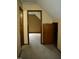 Hallway view showcases a room with beige carpeting and unique attic access at 2315 George Anderson Dr, Hillsborough, NC 27278