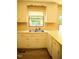Bright kitchen featuring a stainless steel sink, laminate countertop, and white cabinets at 2315 George Anderson Dr, Hillsborough, NC 27278