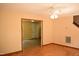 Bright living area featuring wood floors, natural light, and open doorway at 2315 George Anderson Dr, Hillsborough, NC 27278
