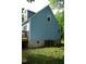 Exterior of home featuring light-blue siding, windows and a back deck at 2315 George Anderson Dr, Hillsborough, NC 27278