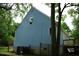 Exterior of home featuring light-blue siding, windows and a back deck at 2315 George Anderson Dr, Hillsborough, NC 27278