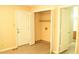 Bright room with neutral walls and floors, closet, and access to the entryway at 2315 George Anderson Dr, Hillsborough, NC 27278