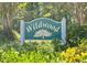 Wildwood community sign surrounded by greenery at 2315 George Anderson Dr, Hillsborough, NC 27278
