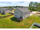 Aerial view of backyard of home featuring a fence, and a deck at 2415 Ivy Knoll Dr, Mebane, NC 27302