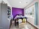 Cozy bedroom with a colorful accent wall and natural light at 2415 Ivy Knoll Dr, Mebane, NC 27302