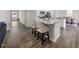 Open-concept kitchen with granite countertops and hardwood floors at 2415 Ivy Knoll Dr, Mebane, NC 27302