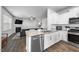This kitchen features stainless steel appliances, granite countertops, and modern lighting at 2415 Ivy Knoll Dr, Mebane, NC 27302