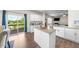 Kitchen with granite countertops, stainless steel appliances, hardwood floors, and a walk-out to the deck at 2415 Ivy Knoll Dr, Mebane, NC 27302