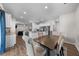 Open concept kitchen with granite countertops, stainless steel appliances, and a view of the living room at 2415 Ivy Knoll Dr, Mebane, NC 27302