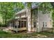 Exterior view of a home with a screened porch, complemented by a well-maintained lawn at 2540 Beech Gap Ct, Raleigh, NC 27603