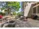 Backyard stone patio with built-in fire pit, stylish seating and a spacious area for entertaining at 2540 Beech Gap Ct, Raleigh, NC 27603
