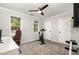 Bedroom with workout bike, desk, carpet, ceiling fan and two windows at 2540 Beech Gap Ct, Raleigh, NC 27603