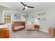 Cozy Bedroom with a crib, ceiling fan, soft chair, and decor at 2540 Beech Gap Ct, Raleigh, NC 27603