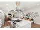 Bright, open-concept kitchen with modern island, leading to dining and living areas at 2540 Beech Gap Ct, Raleigh, NC 27603