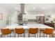 Open kitchen with a large island featuring seating, stainless steel appliances, and ample counter space at 2540 Beech Gap Ct, Raleigh, NC 27603
