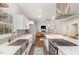 Open kitchen layout with stainless steel appliances and large island flowing into the dining area at 2540 Beech Gap Ct, Raleigh, NC 27603