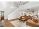 Spacious open living area with modern decor, wood floors, and a staircase to the upper level at 2540 Beech Gap Ct, Raleigh, NC 27603